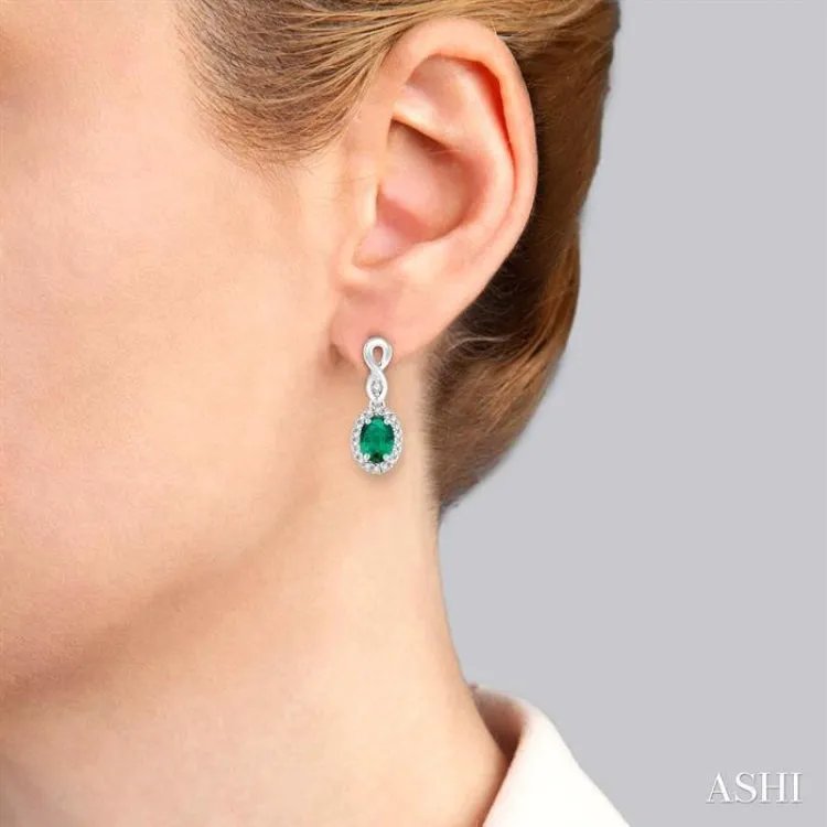 5x3 MM Oval Cut Emerald and 1/6 Ctw Round Cut Diamond Earrings in 10K White Gold